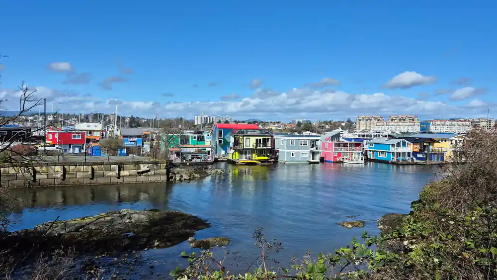 Brightly painted float homes along a Victoria wharf