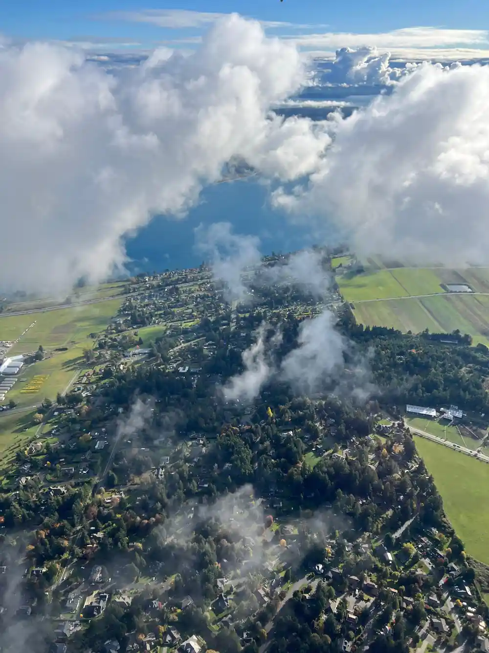 Farmland and cloud shadows on the island from the air