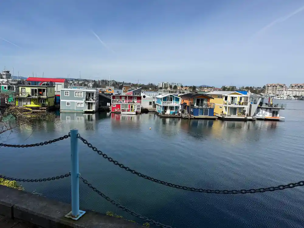 Float homes along the Victoria waterfront seen from the causeway