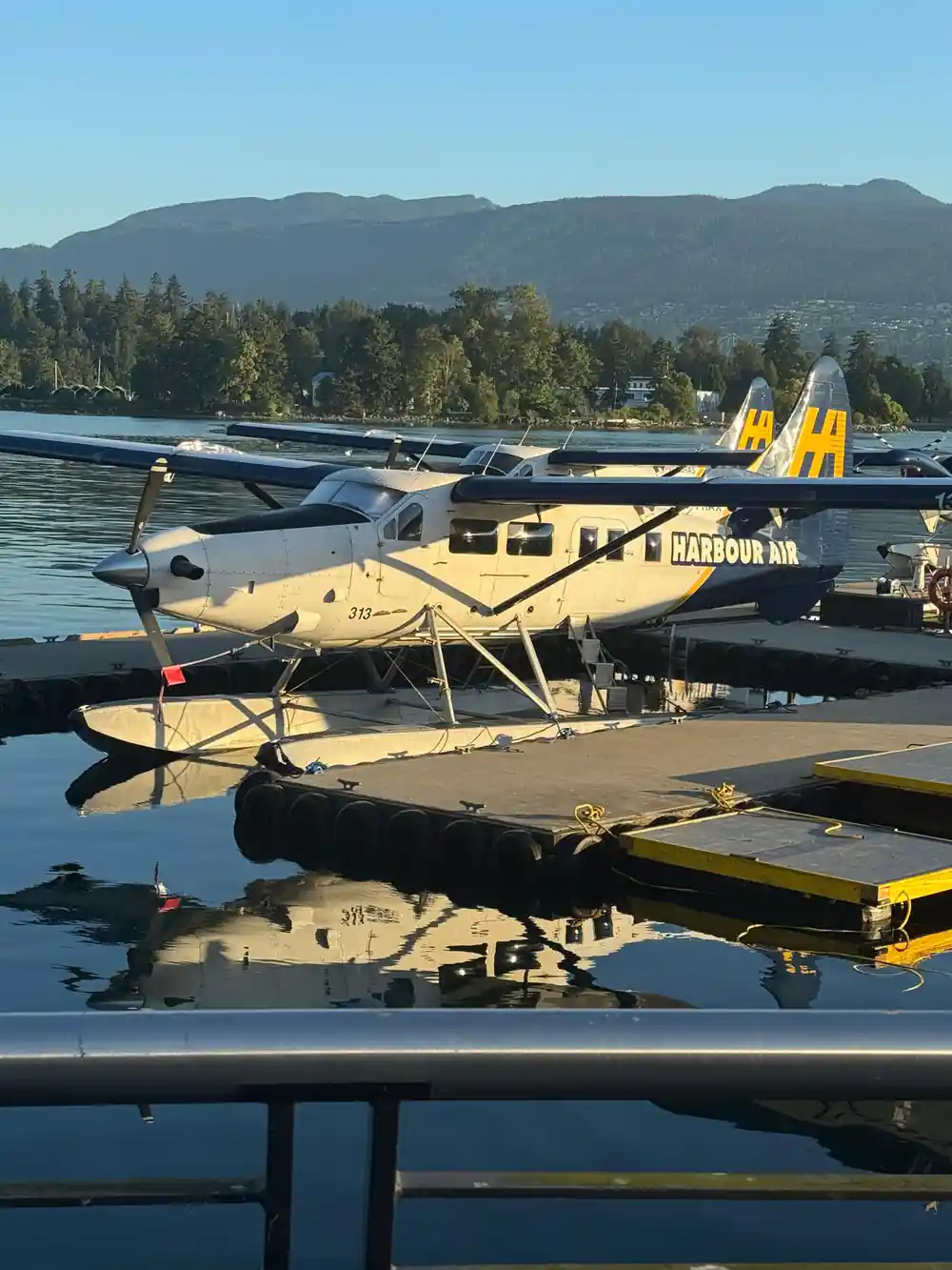 Two Harbour Air aircraft moored side by side at the dock