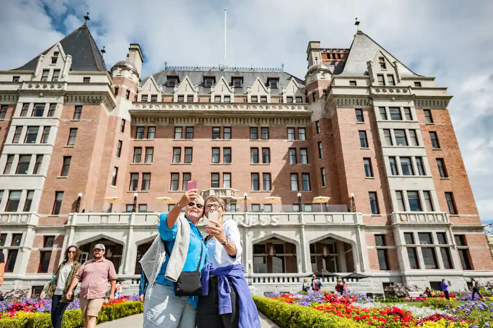 Visitors photographing themselves in front of the Empress hotel